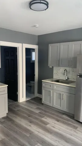 a kitchen with a sink cabinets and appliances