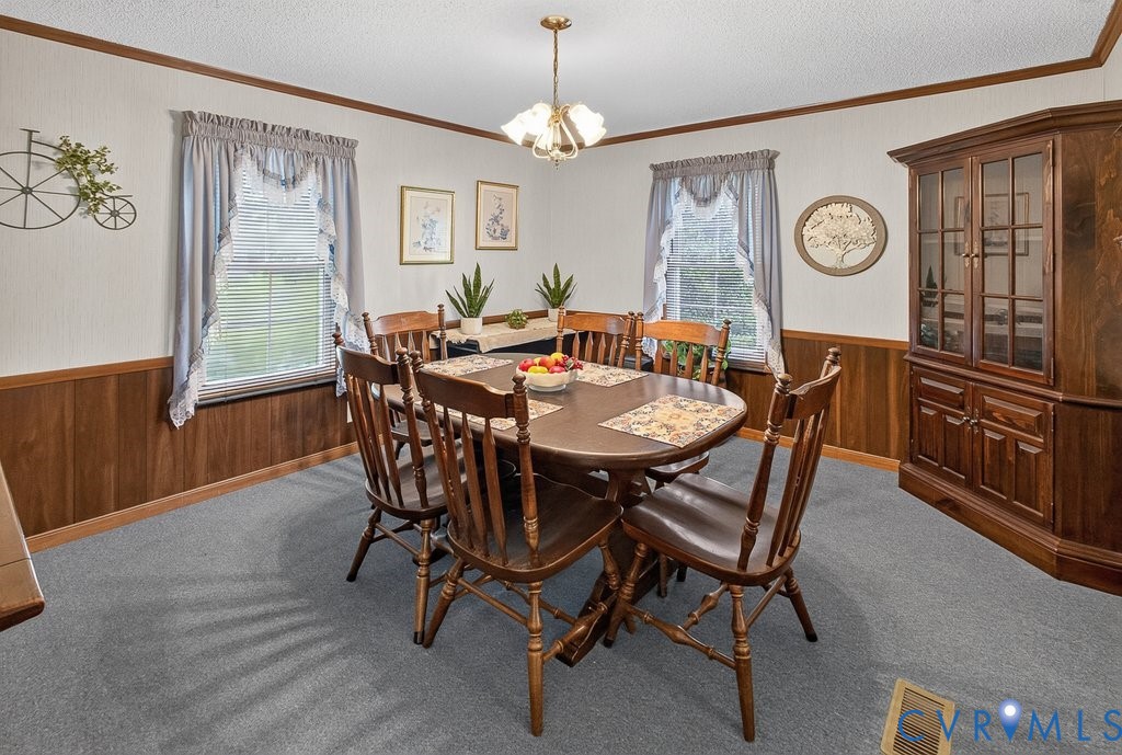 19541 Templeton Road Carson, VA 23830 - Photo 9 of 39 Dining area featuring wood-finish wainscoting, lig