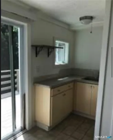 a kitchen with a sink and cabinets