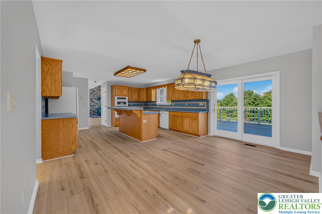 630 Clearfield Road Nazareth, PA 18064 - Photo 29 of 100 Sliding glass doors open from the spacious dining area to an outdoor deck.