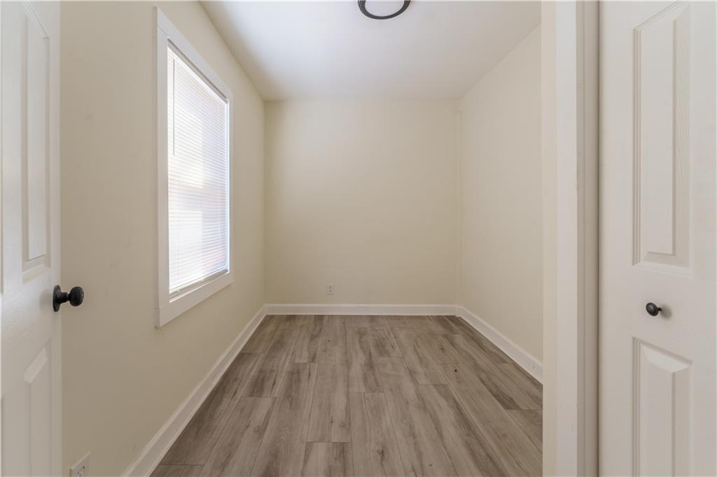 1365 Campbellton Road Southwest Atlanta, GA 30310 - Photo 8 of 36 a view of a small space with wooden floor and a window
