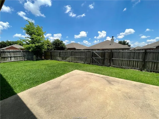 a view of a backyard with a garden