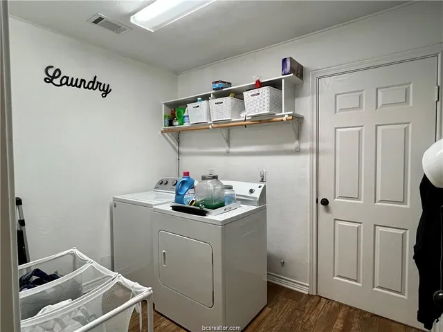a room with cabinets and wooden floor