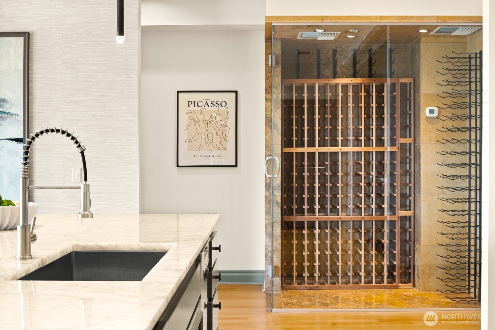 505 West Mercer Place, Unit 101 Seattle, WA 98119 - Photo 12 of 24 a view of a bathroom with a sink and mirror