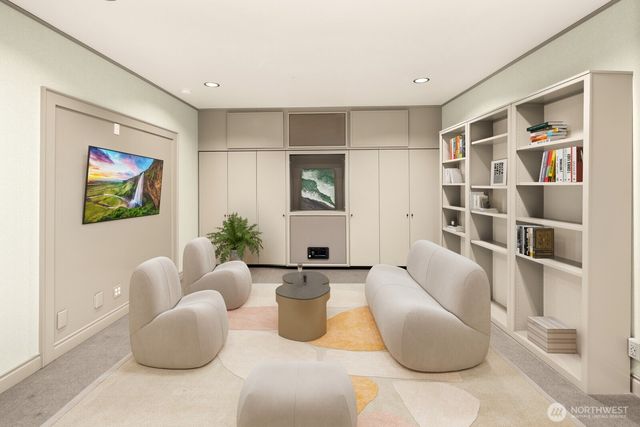 a living room with furniture and a book shelf