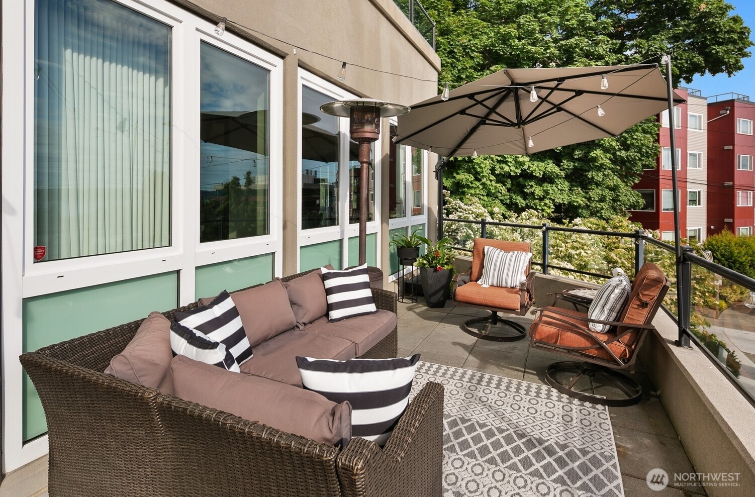 505 West Mercer Place, Unit 101 Seattle, WA 98119 - Photo 22 of 24 a patio with a table and chairs