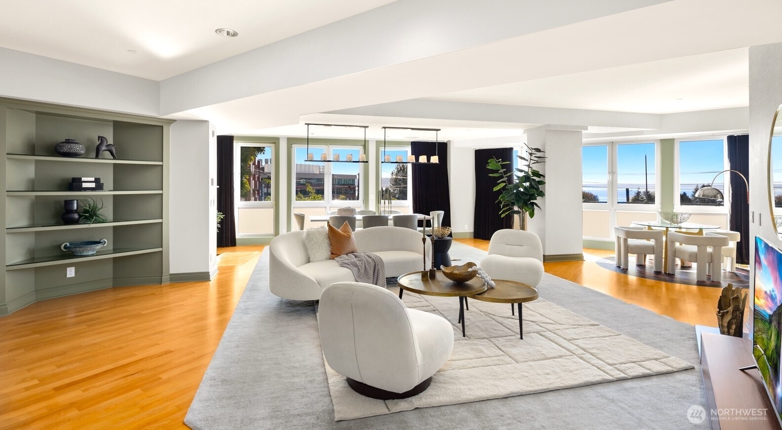 505 West Mercer Place, Unit 101 Seattle, WA 98119 - Photo 3 of 24 a living room with furniture and large windows