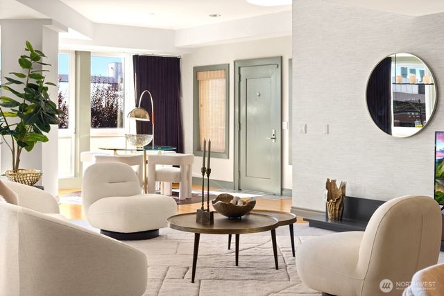 a living room with furniture and a large mirror