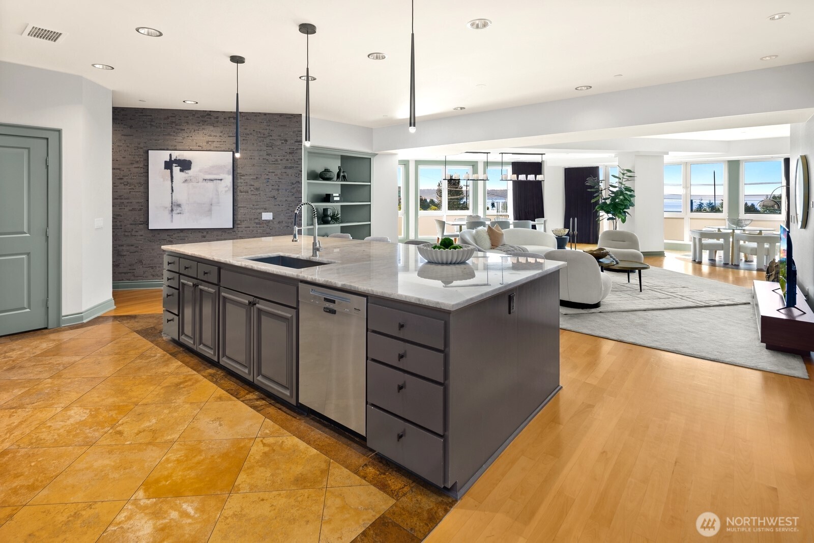 505 West Mercer Place, Unit 101 Seattle, WA 98119 - Photo 8 of 24 a kitchen with a sink and living room view