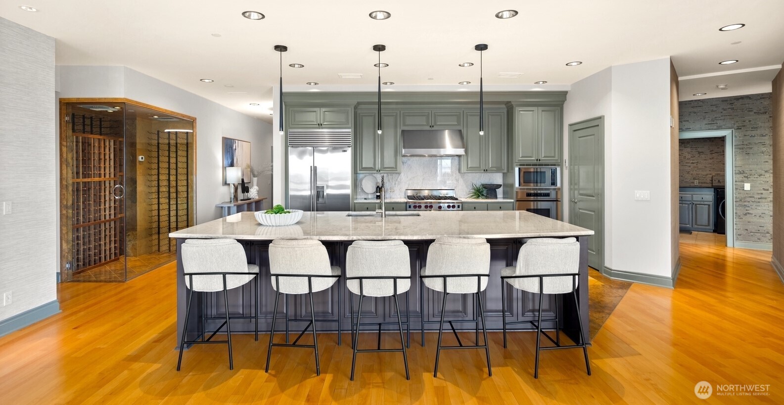 505 West Mercer Place, Unit 101 Seattle, WA 98119 - Photo 9 of 24 a dining room with furniture and wooden floor