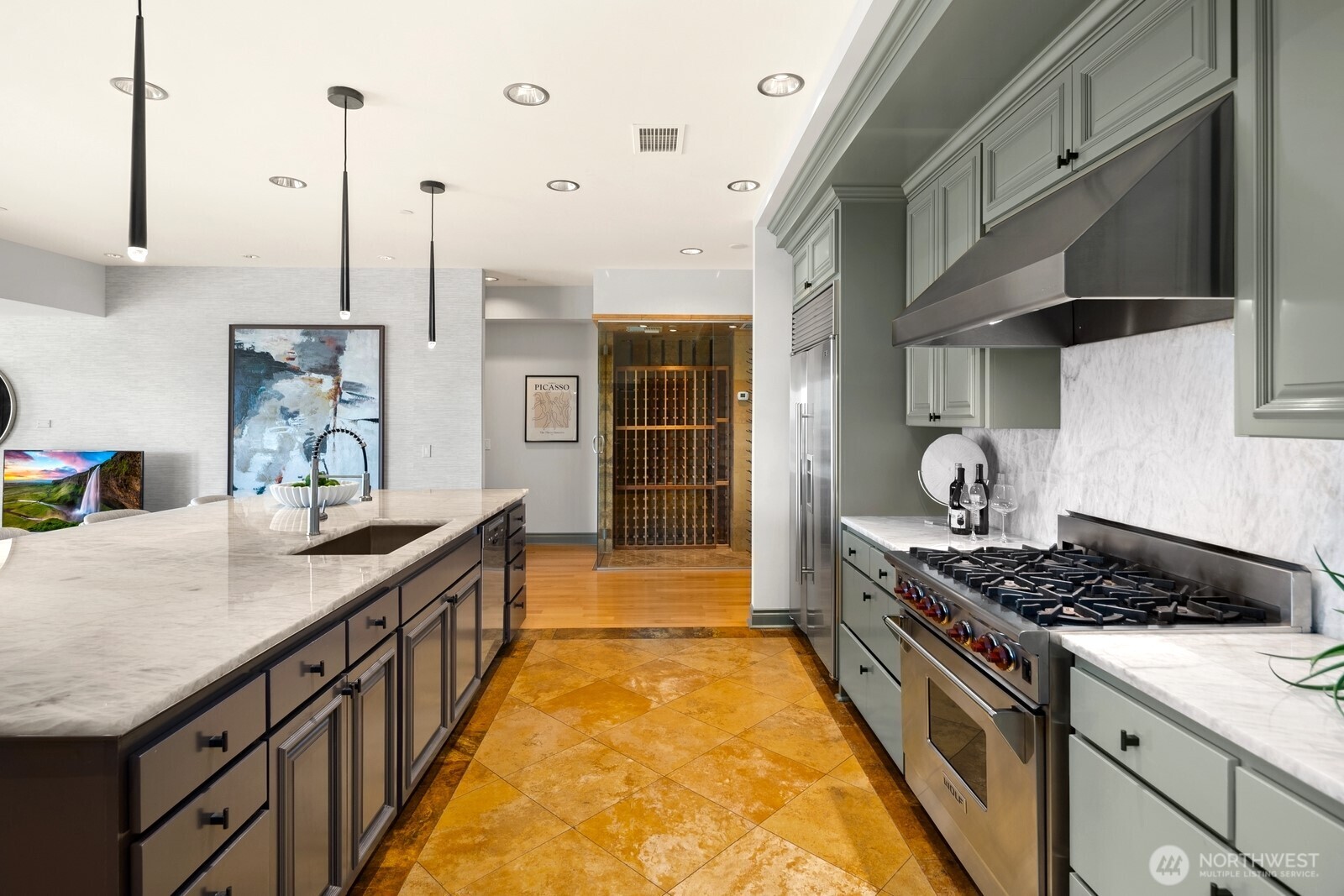 505 West Mercer Place, Unit 101 Seattle, WA 98119 - Photo 10 of 24 a kitchen with sink stove and cabinets