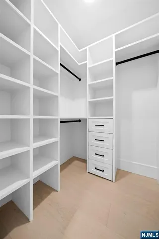 a view of an empty walk in closet