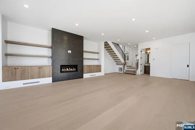 a view of an empty room with a cabinet