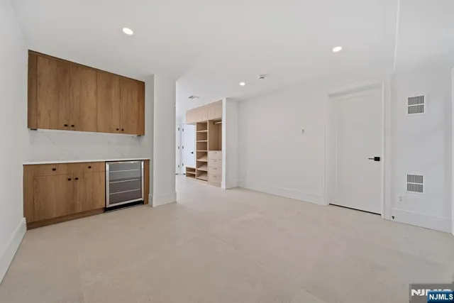 a view of empty room with a fireplace