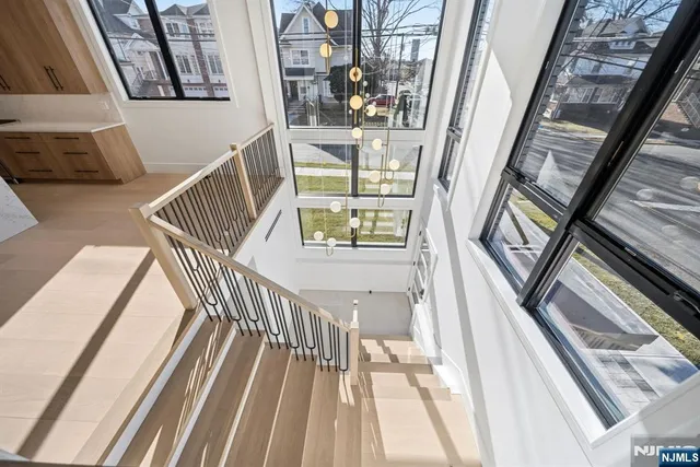 a view of a balcony with a floor to ceiling window and wooden floor