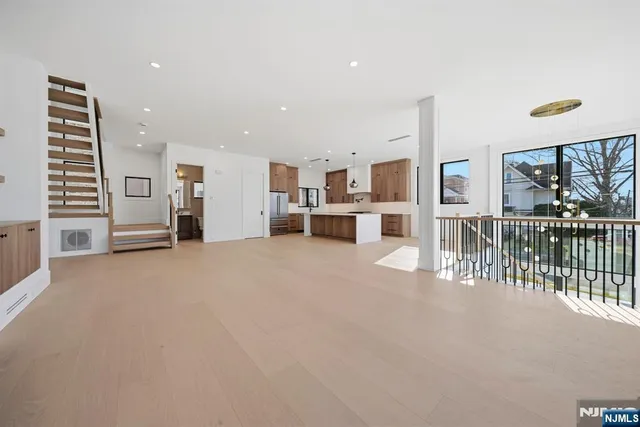 a view of a livingroom with furniture and a flat screen tv