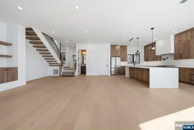 a view of a kitchen with a sink and cabinets