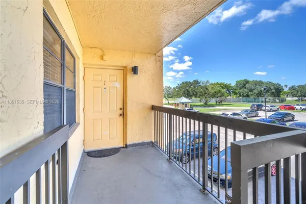 a kitchen with stainless steel appliances kitchen island granite countertop a stove and a sink
