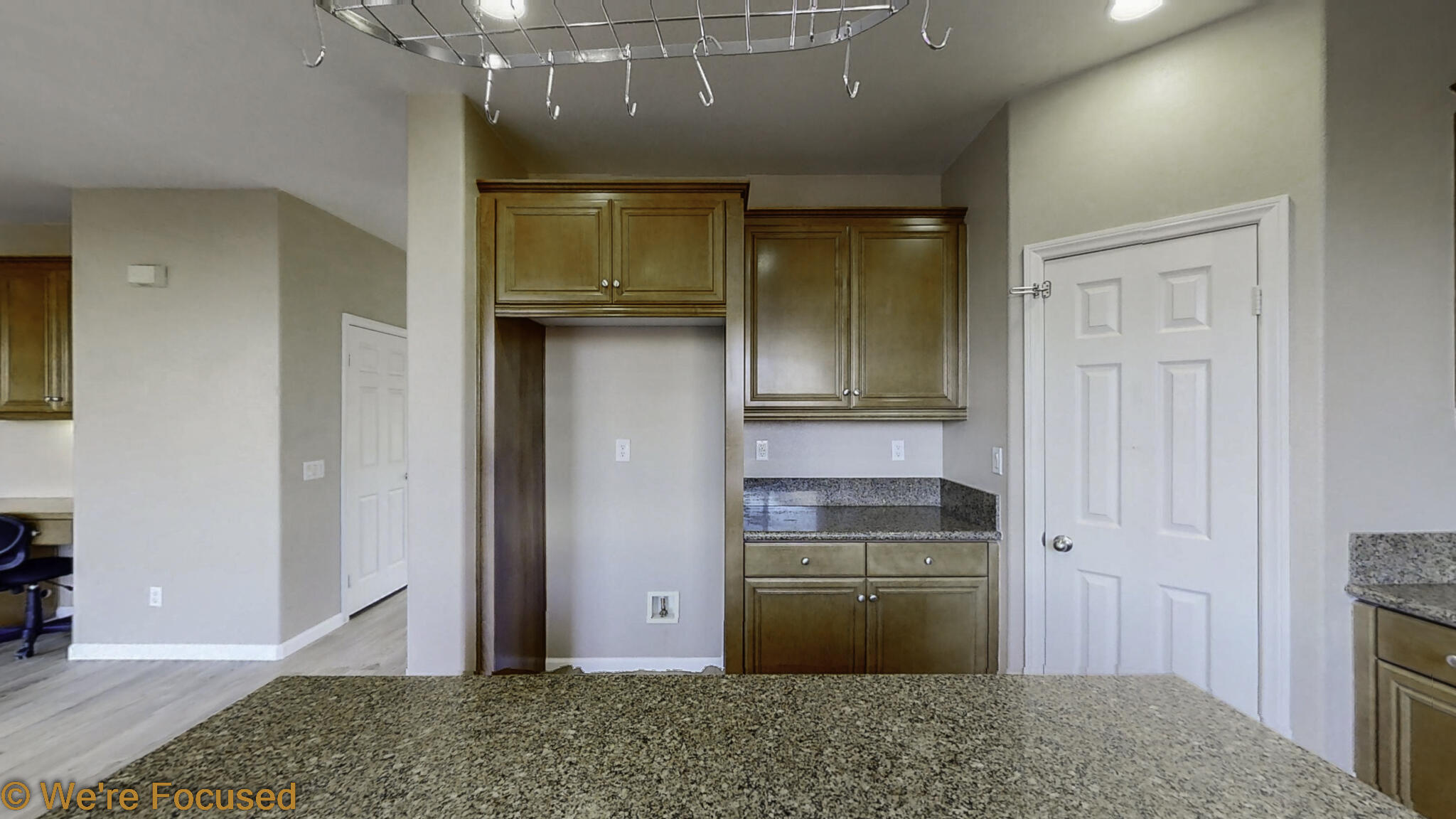 688 Suncup Circle Hemet, CA 92543 - Photo 15 of 65 a view of a kitchen with wooden floor and cabinets
