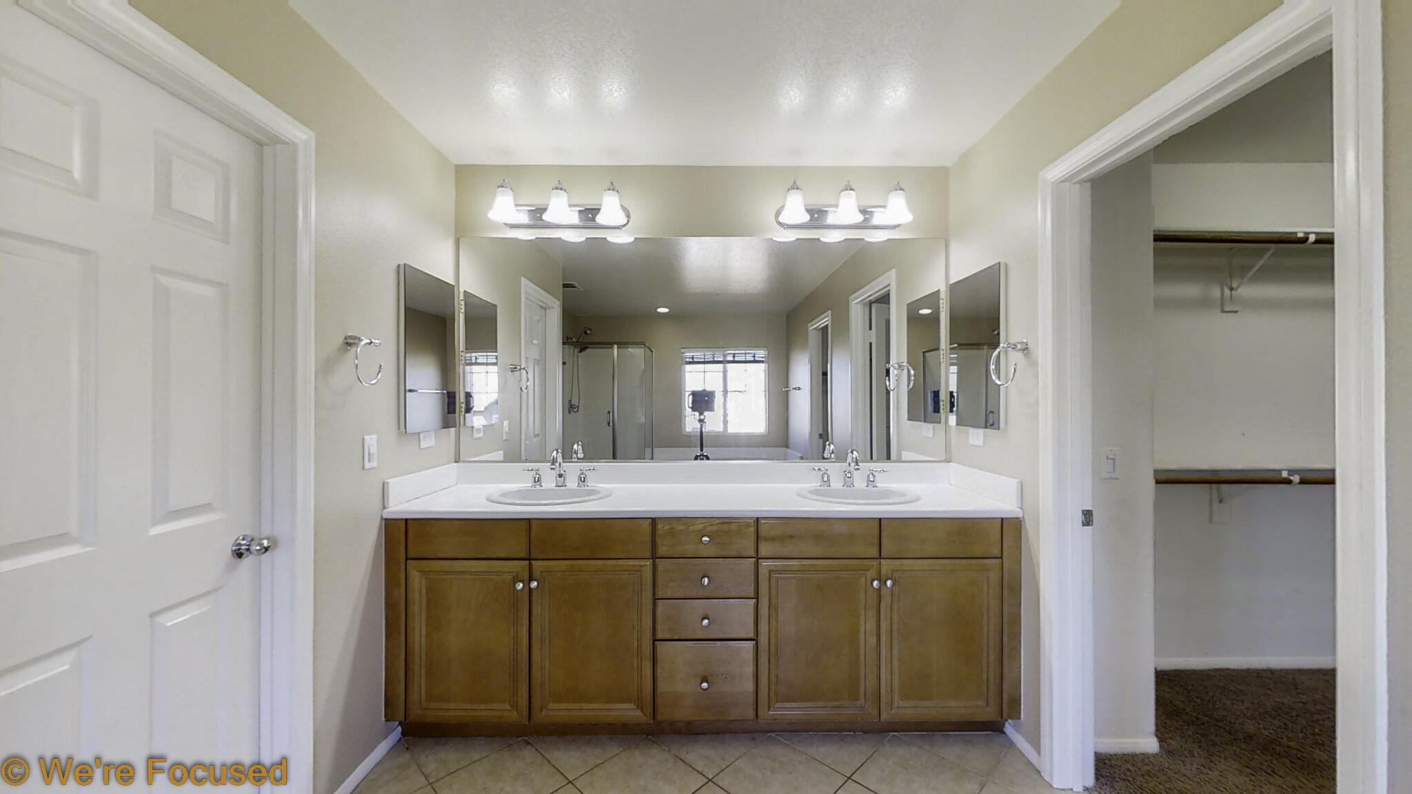 688 Suncup Circle Hemet, CA 92543 - Photo 29 of 65 a bathroom with a double vanity sink and a mirror