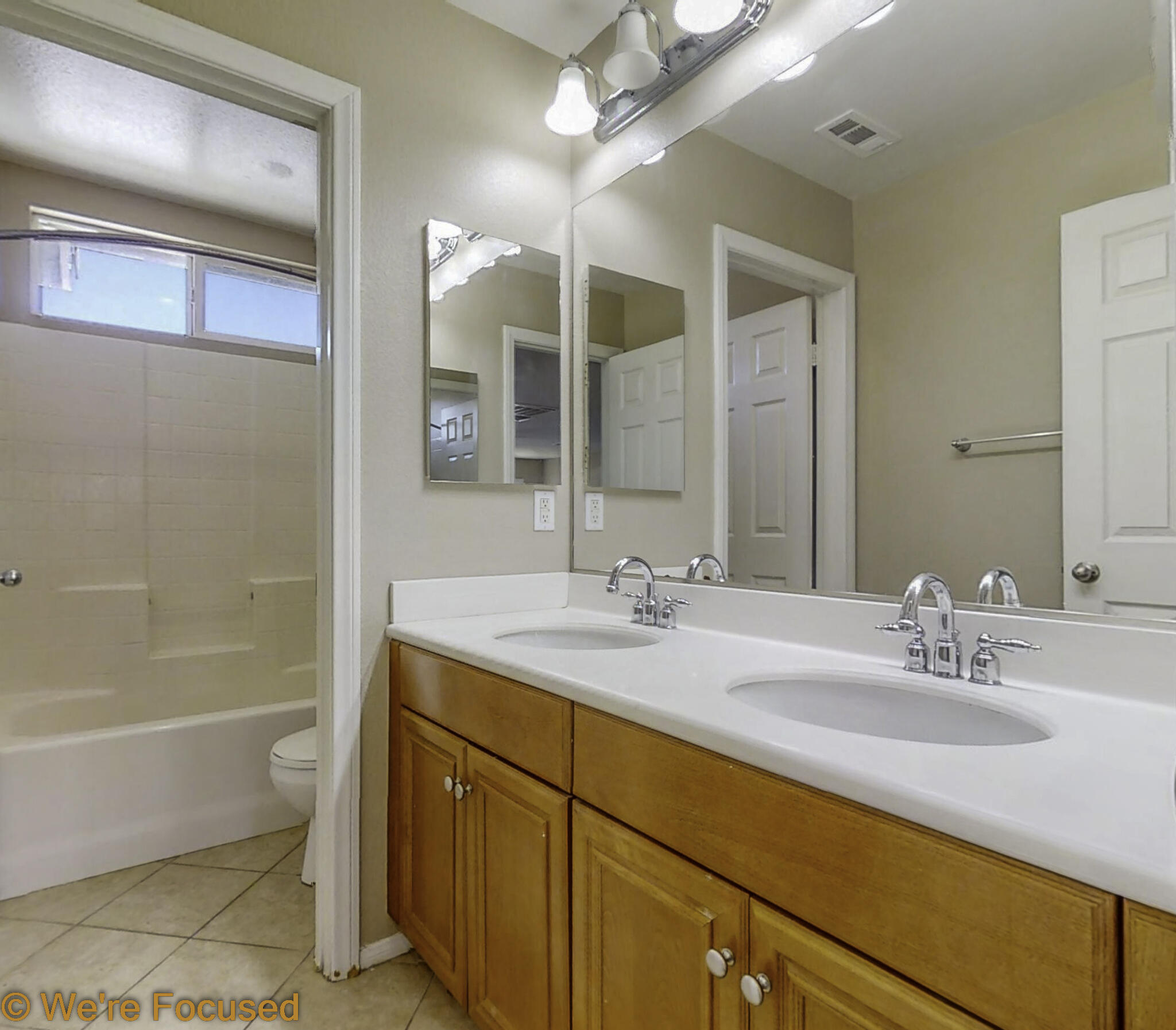 688 Suncup Circle Hemet, CA 92543 - Photo 34 of 65 a bathroom with a granite countertop sink a toilet and bathtub