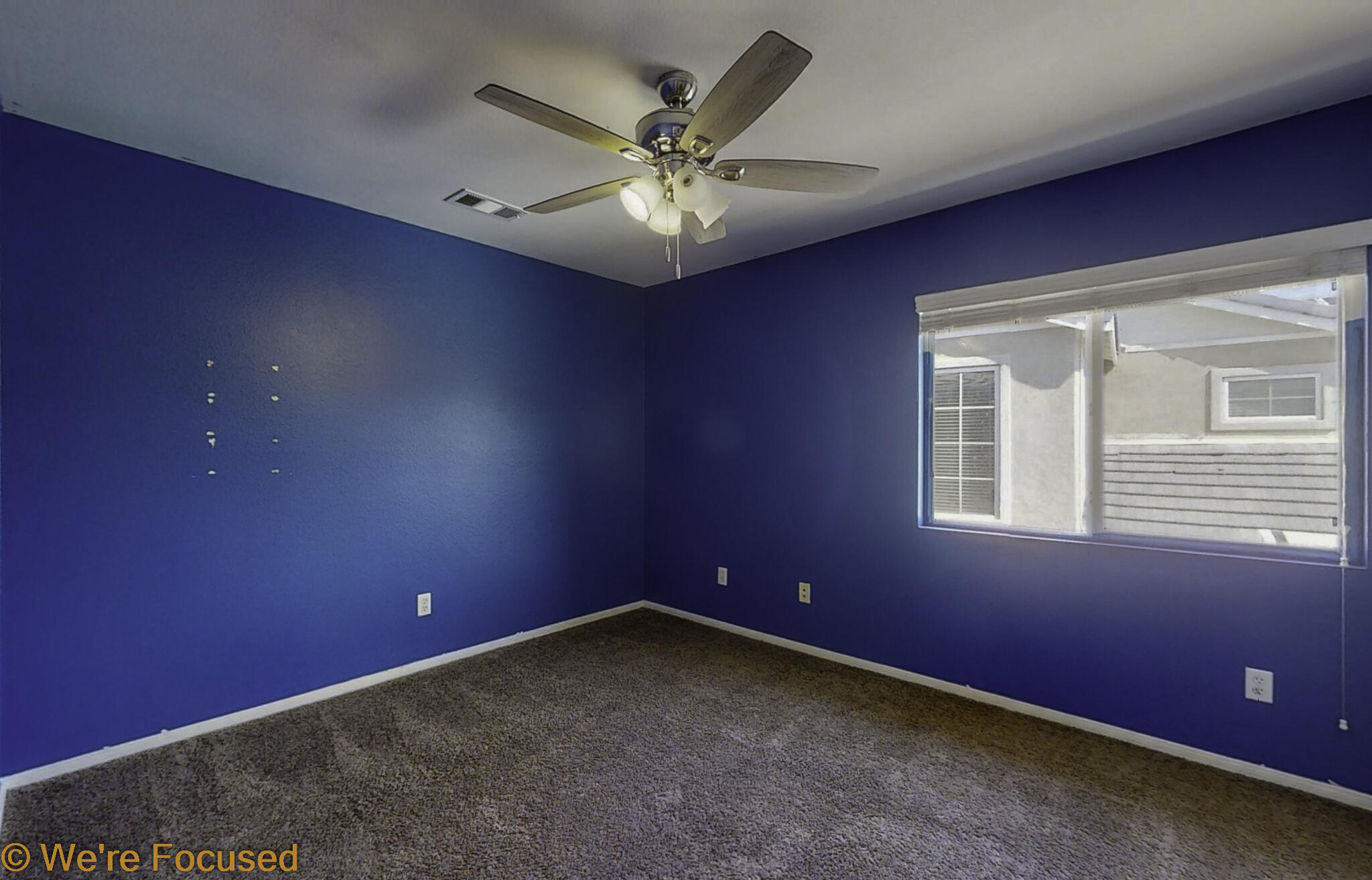 688 Suncup Circle Hemet, CA 92543 - Photo 36 of 65 an empty room with a ceiling fan and window