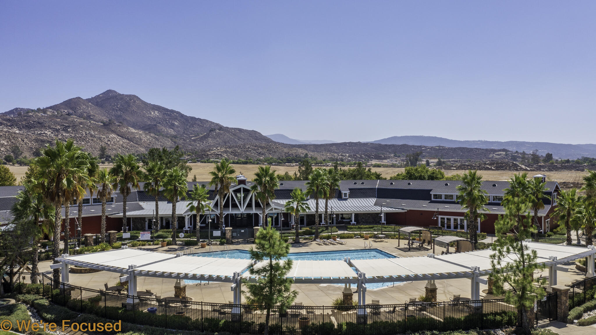 688 Suncup Circle Hemet, CA 92543 - Photo 61 of 65 a view of swimming pool with outdoor seating and a garden