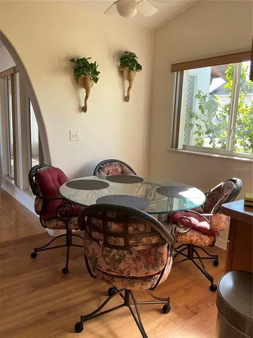 a view of a dining room with furniture and wooden floor