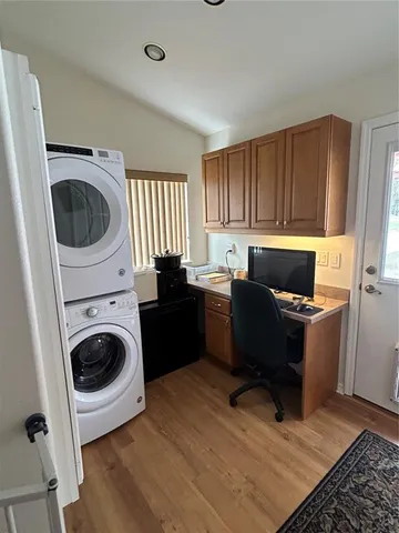 a kitchen with a refrigerator and a sink