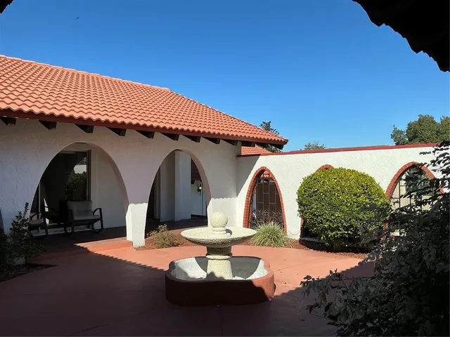 a front view of a house with yard