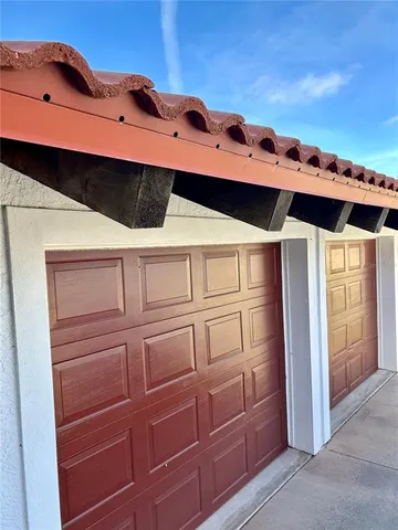 a view of a balcony with cabinets