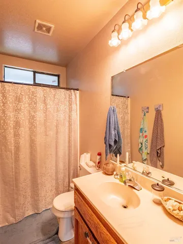 a bedroom with a bed and a closet