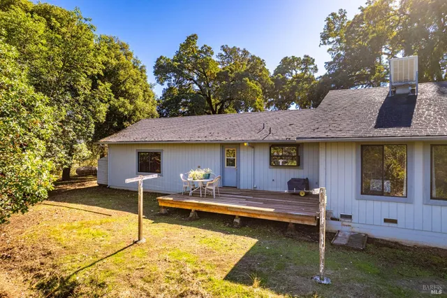 a view of a swimming pool with an outdoor seating and a garden