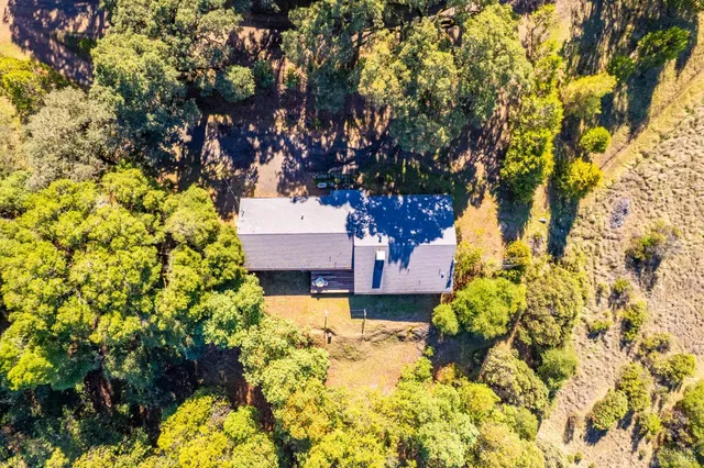 a view of a swimming pool with a yard