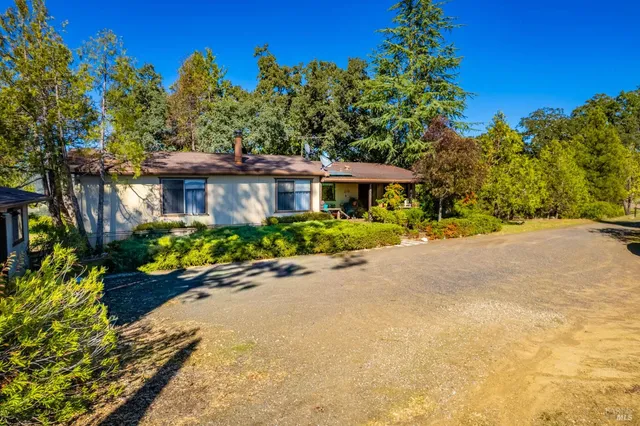 a spacious bathroom with a tub sink and mirror