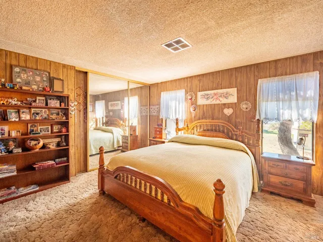 a view of a patio with wooden floor