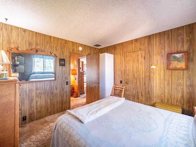 a view of a house with a porch and furniture