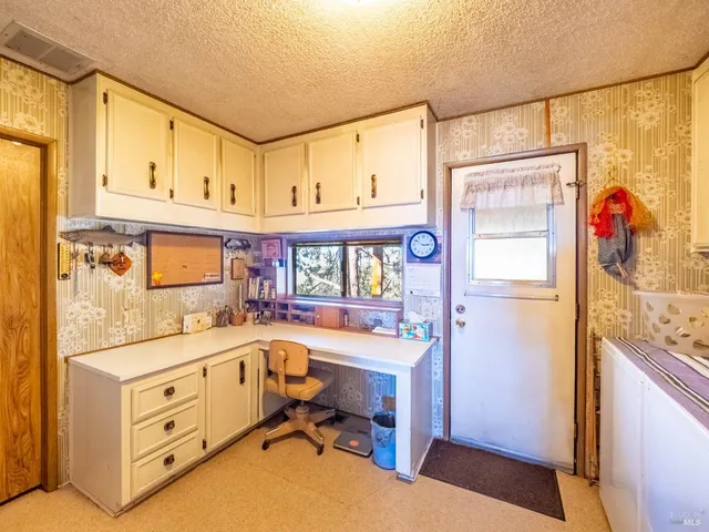 a room with lots of furniture and equipment