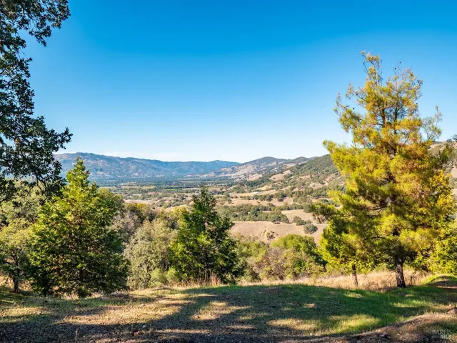 a view of mountain with sunset view