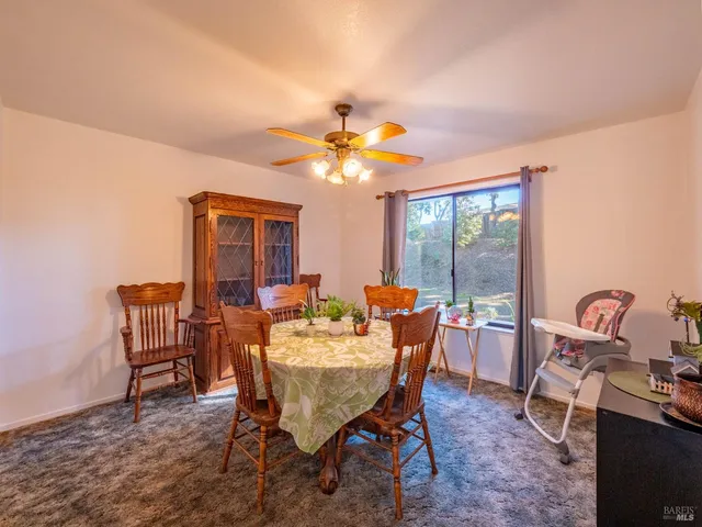 a kitchen with stainless steel appliances granite countertop a refrigerator a stove and a sink