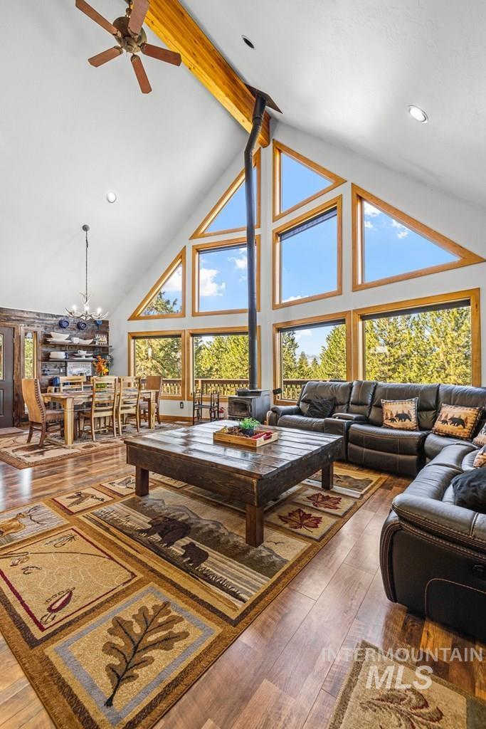 30 Redtail Lane McCall, ID 83638 - Photo 24 of 50 Living area featuring dark wood-style floors, a ceiling fan, and suspended lighting