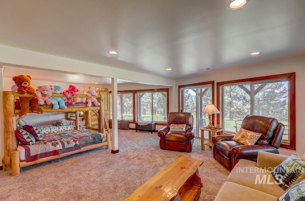 30 Redtail Lane McCall, ID 83638 - Photo 25 of 50 Living room with light carpet and recessed lighting