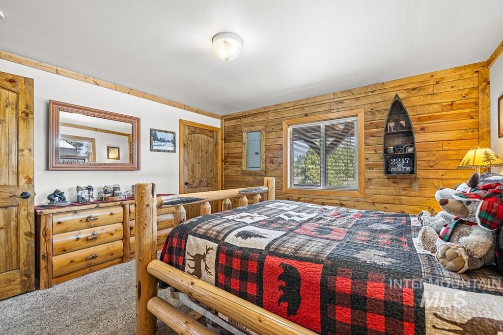 30 Redtail Lane McCall, ID 83638 - Photo 31 of 50 Carpeted bedroom featuring wooden walls and electric panel