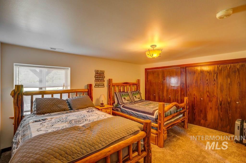 30 Redtail Lane McCall, ID 83638 - Photo 33 of 50 Bedroom featuring a closet and carpet flooring