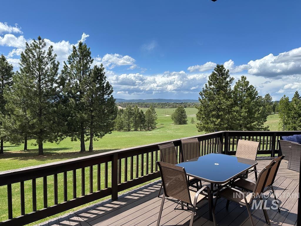 30 Redtail Lane McCall, ID 83638 - Photo 49 of 50 Wooden terrace featuring outdoor dining area and a lawn