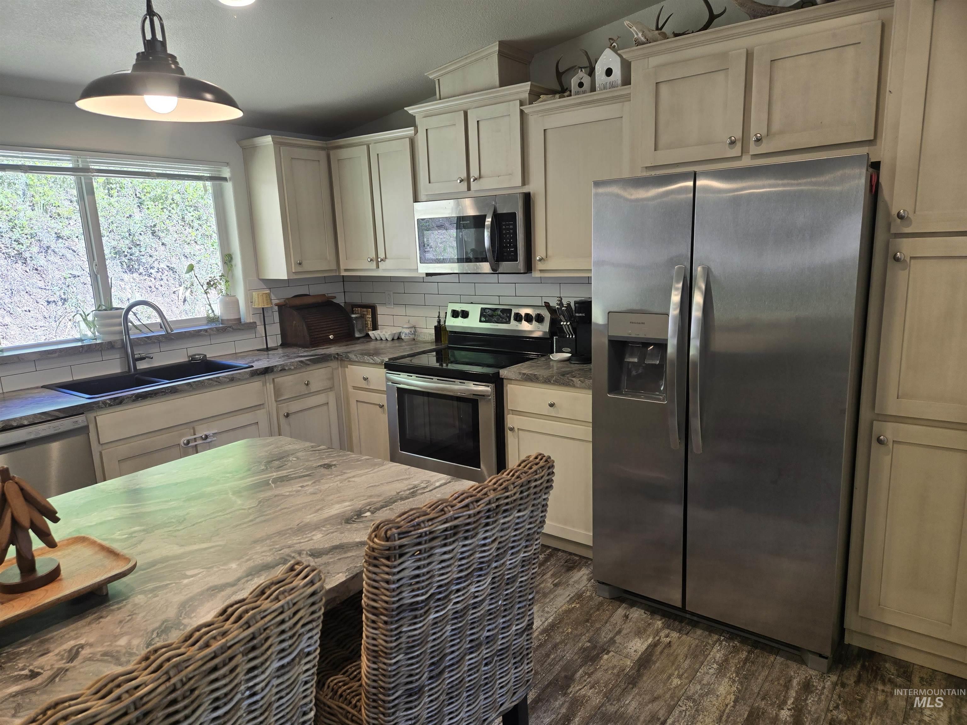 174 Konkolville Road Orofino, ID 83544 - Photo 7 of 43 Kitchen featuring a stainless steel French door refrigerator, stainless steel range, and stainless steel microwave