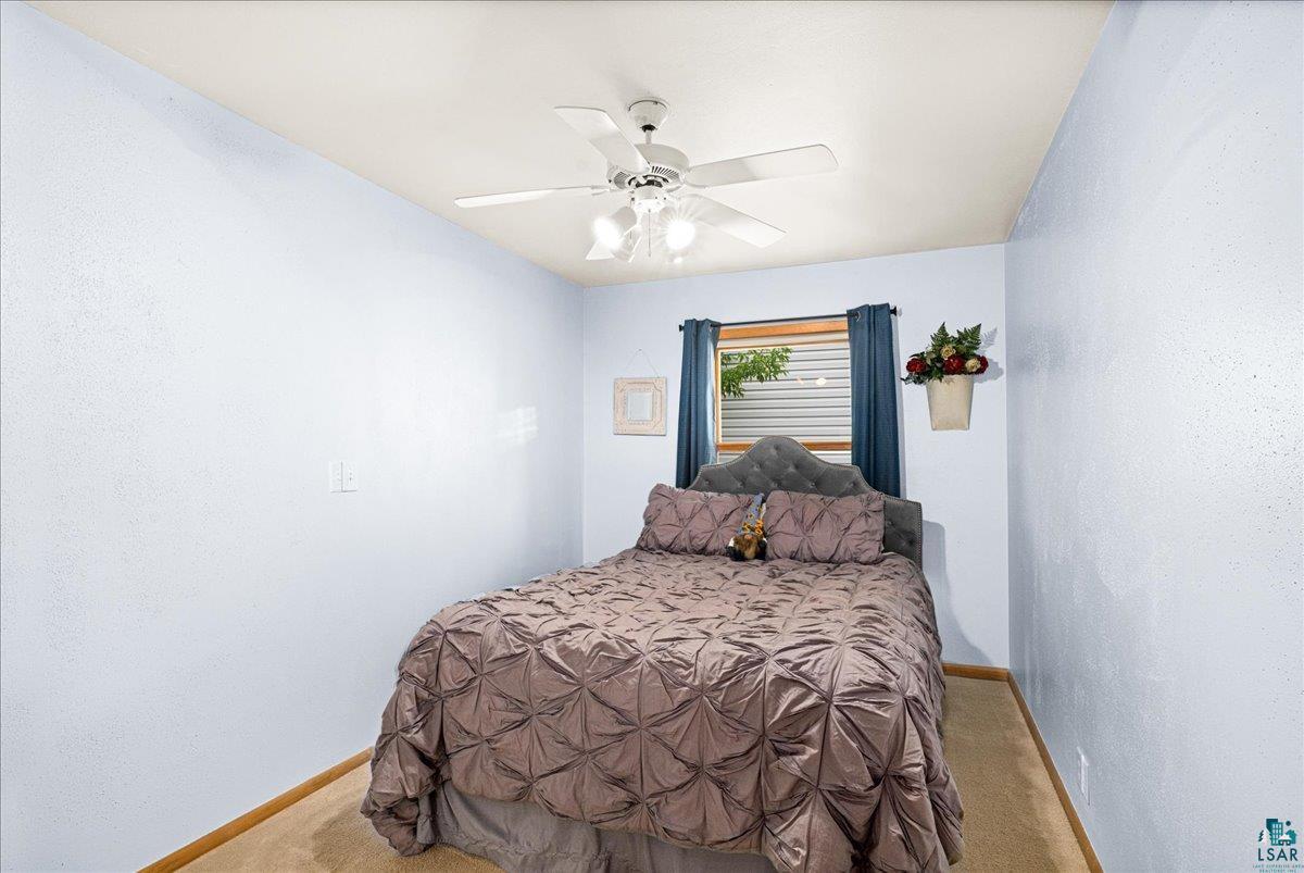 130 West Austin Street Duluth, MN 55803 - Photo 13 of 35 Carpeted room featuring light blue walls and a white ceiling with a ceiling fan