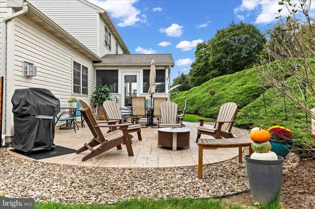 a view of backyard with a table and chairs