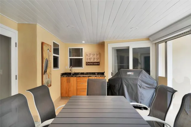 a living room with furniture rug and wooden floor