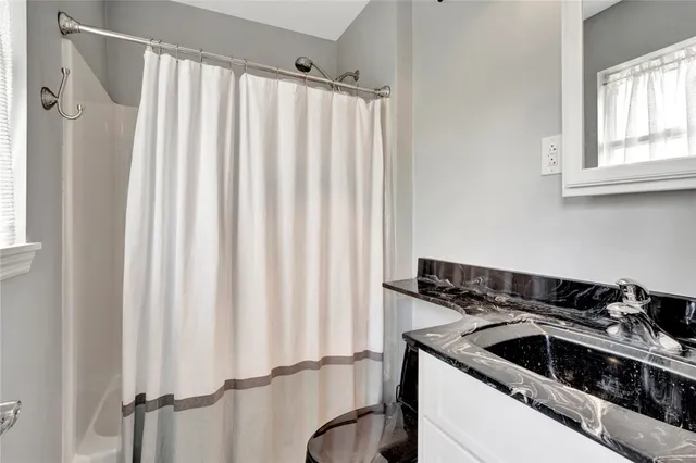 a kitchen with a refrigerator and a sink